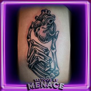 Black and grey praying skeleton tattoo