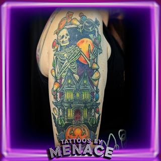 Color skeleton and haunted house sleeve tattoo