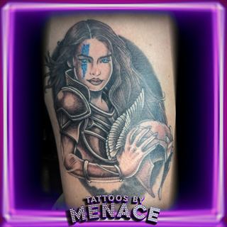 Color realism warrior woman and xenomorph tattoo on the thigh