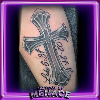 Black and grey cross tattoo with Luke 6:31 script lettering on the forearm