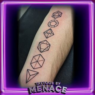 Fine line geometric dice and gemstone tattoo down the forearm
