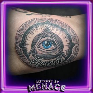 Black and grey all-seeing eye tattoo with Forever lettering