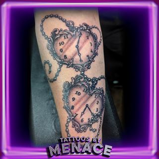 Black and grey heart locket pocket watch tattoo on the forearm