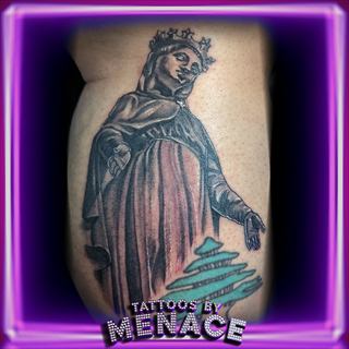 Black and grey statue portrait tattoo on the arm