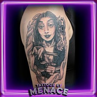 Color gothic woman portrait tattoo on the upper arm
