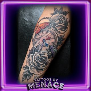 Black and grey pocket watch, rose and butterfly forearm tattoo