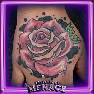 Color rose hand tattoo