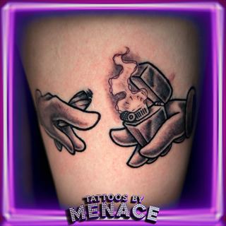 Black and grey cartoon hands tattoo on the thigh